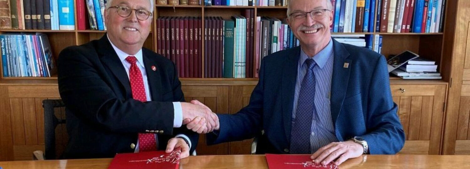 NC State Chancellor Randy Woodson (left) and DTU President Anders Bjarklev (right) shake hands after signing a strategic partnership agreement in May 2023