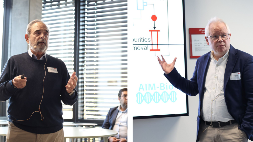 Ruben Carbonell, PhD, (left) and John Woodley, PhD, present research translational outcomes at the AIM-Bio Symposium.
