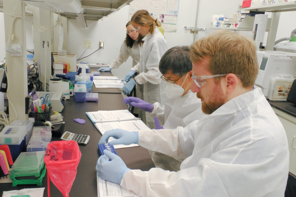 Students participate in a hands-on lab in the Analytical Methods for Gene Therapy course at BTEC.